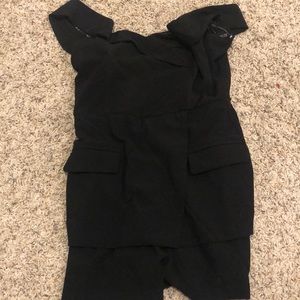 Never worn Black romper from these three boutique
